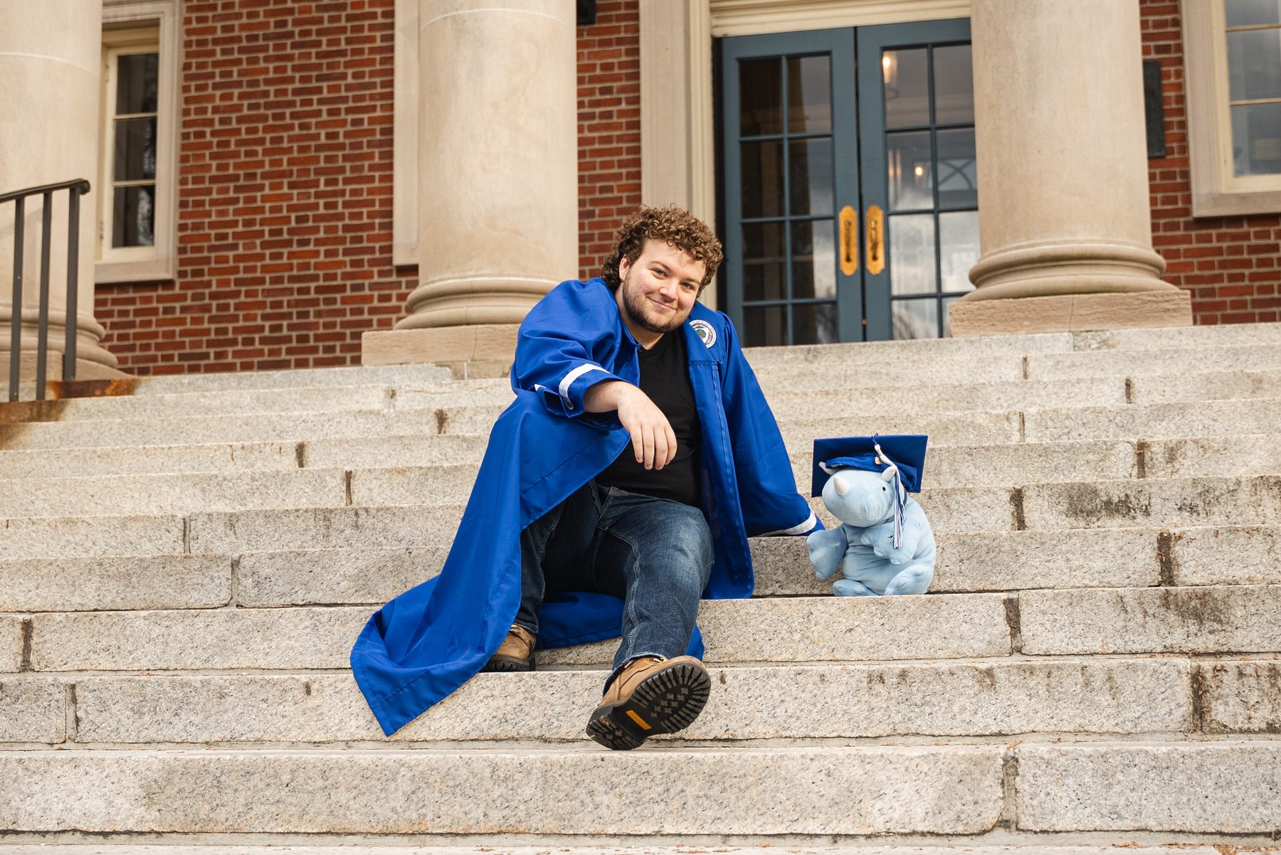 On the steps with the Wheaton mascot