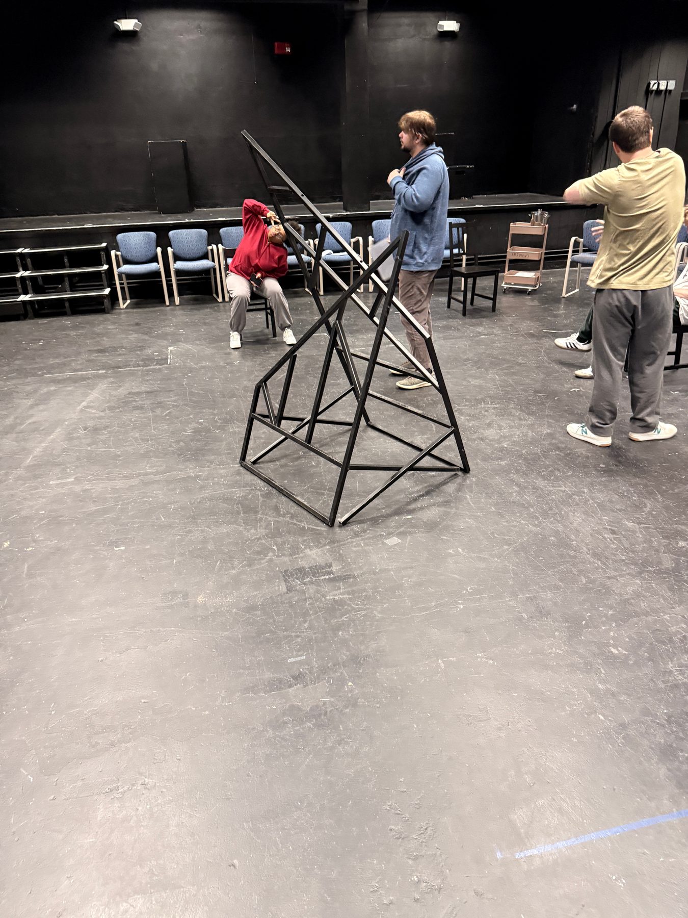 In rehearsal, stood upright for height